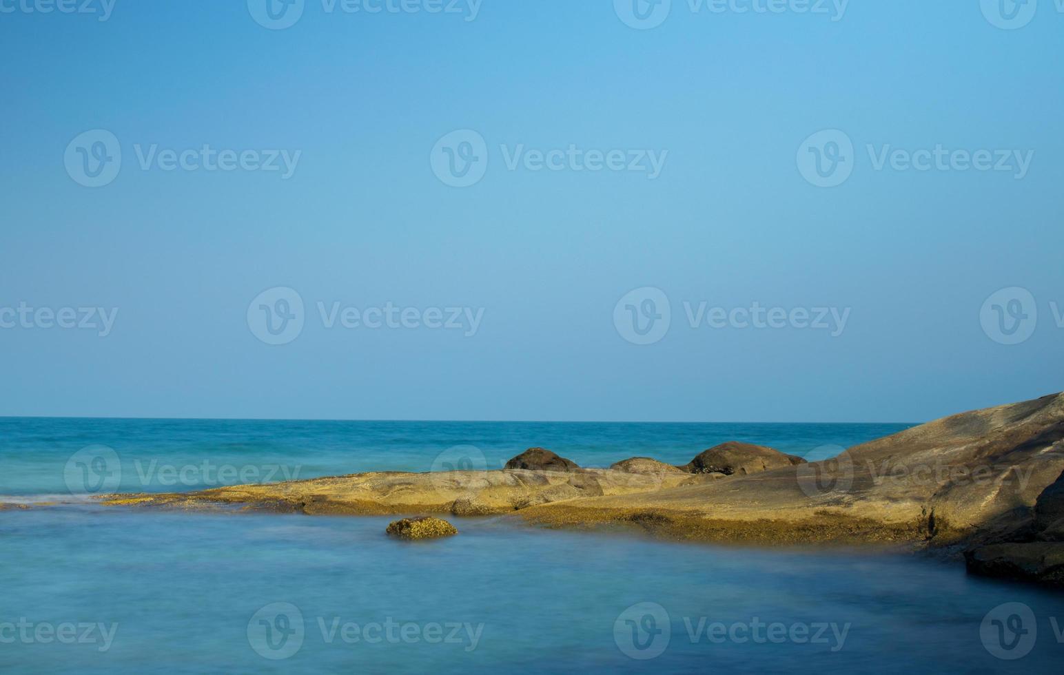 Tropical beach landscape, beautiful rocks and blue sky photo