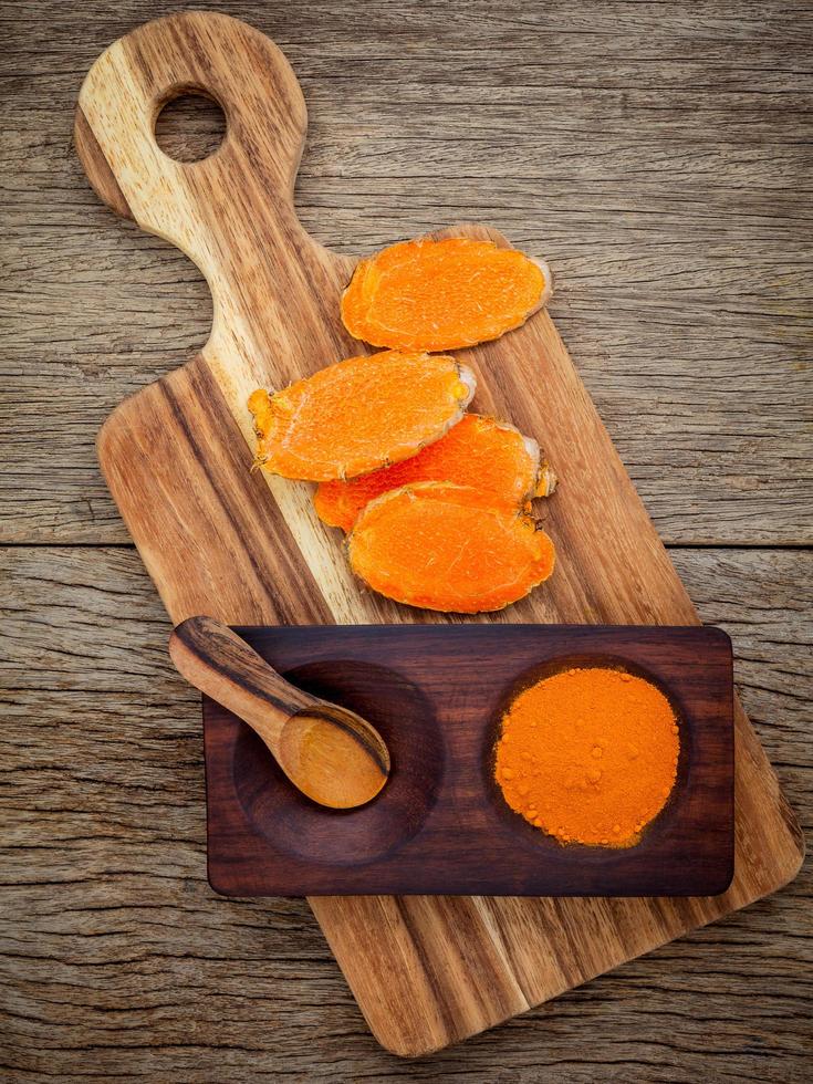 Fresh turmeric on a cutting board photo