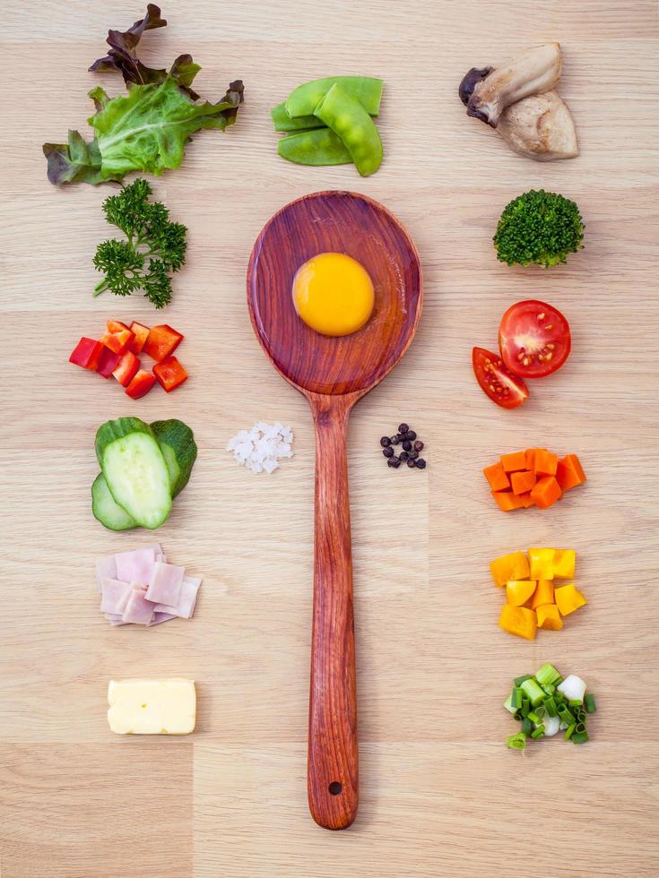 Flat lay of omelet ingredients with a spoon photo