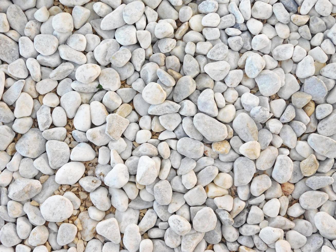 Bed of gray stones or pebbles for background or texture photo