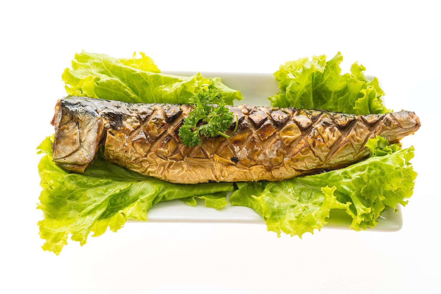 Grilled saba fish with sweet sauce on white plate photo