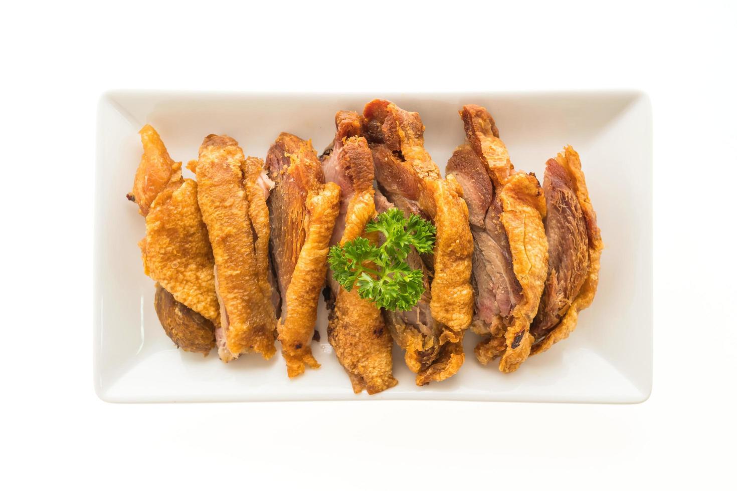 Fried crispy pork on white plate photo