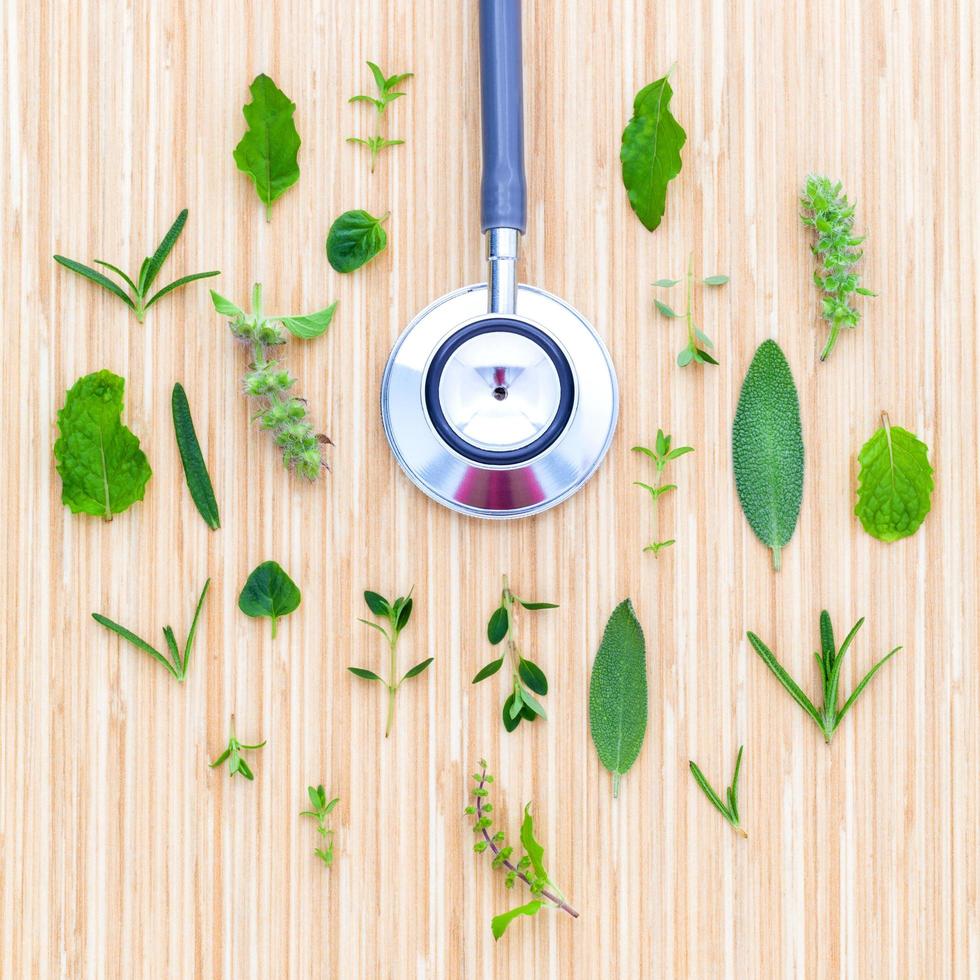 Stethoscope with fresh herbs photo