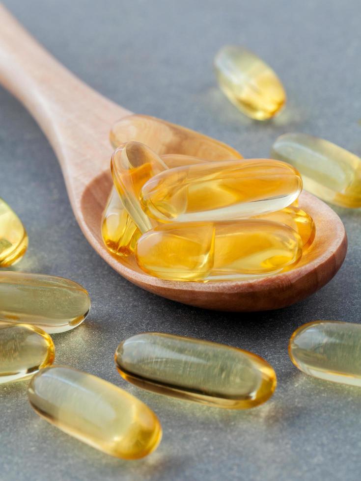Fish oil pills in a spoon photo