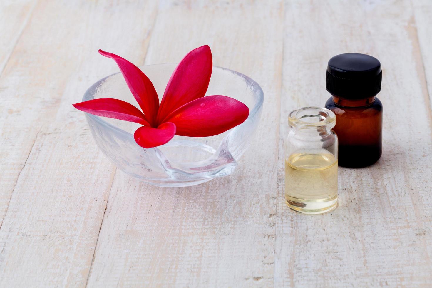 Essential oil with a frangipani flower photo
