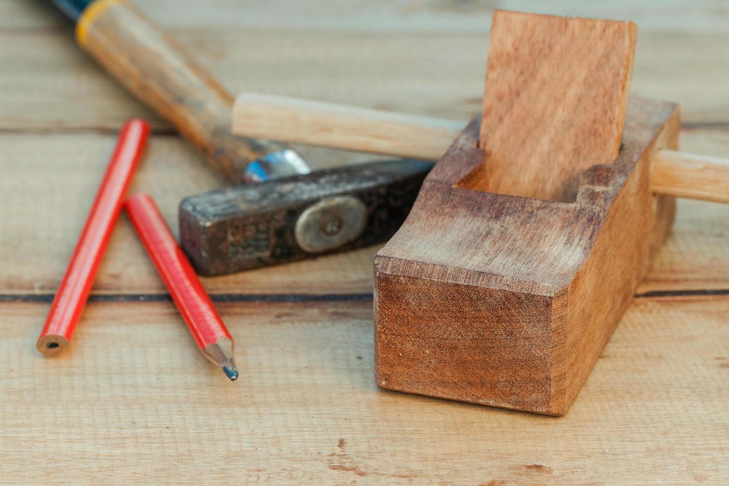 Carpenter plane and hammer photo