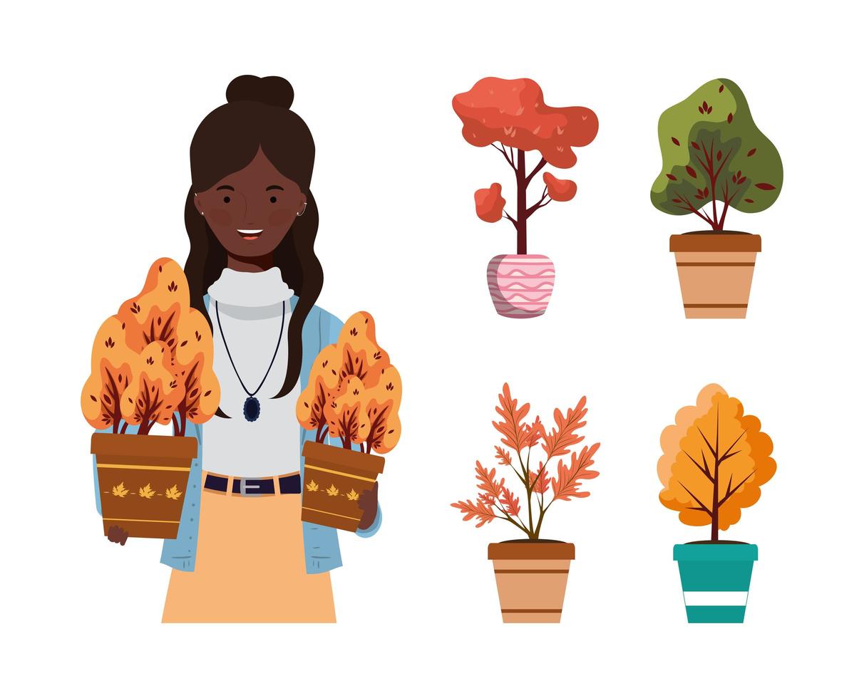 Mujer afro con plantas de otoño en macetas de cerámica vector