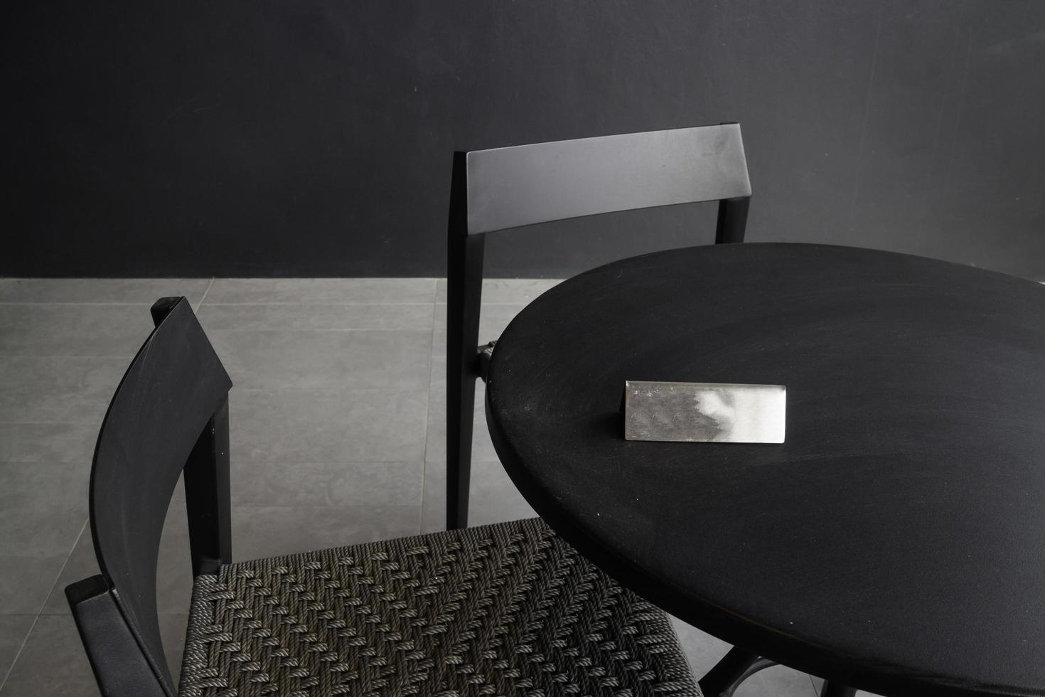 Black cafe table and chairs photo