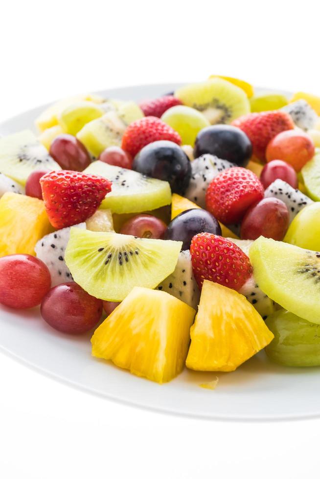 Mixed fruits on white plate photo