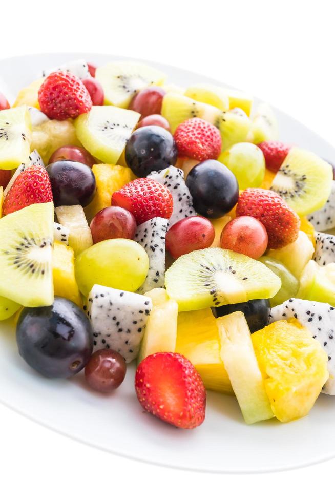 Mixed fruits on white plate photo