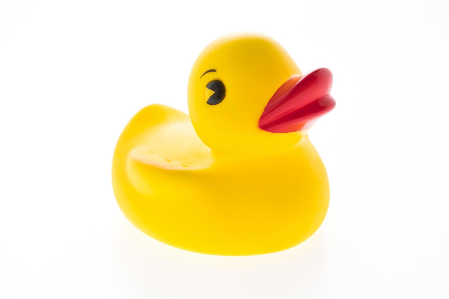 Yellow rubber duck on white background photo