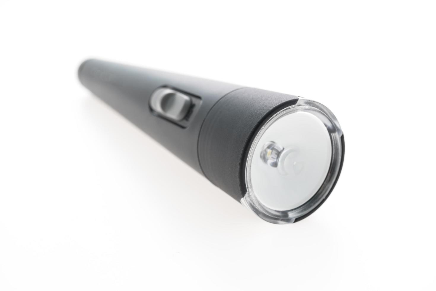 Flashlight on white background photo