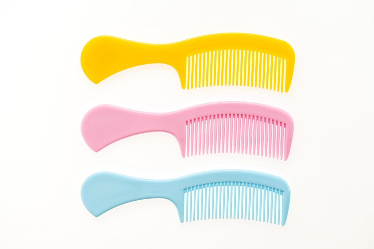 Plastic hair combs isolated on white background photo