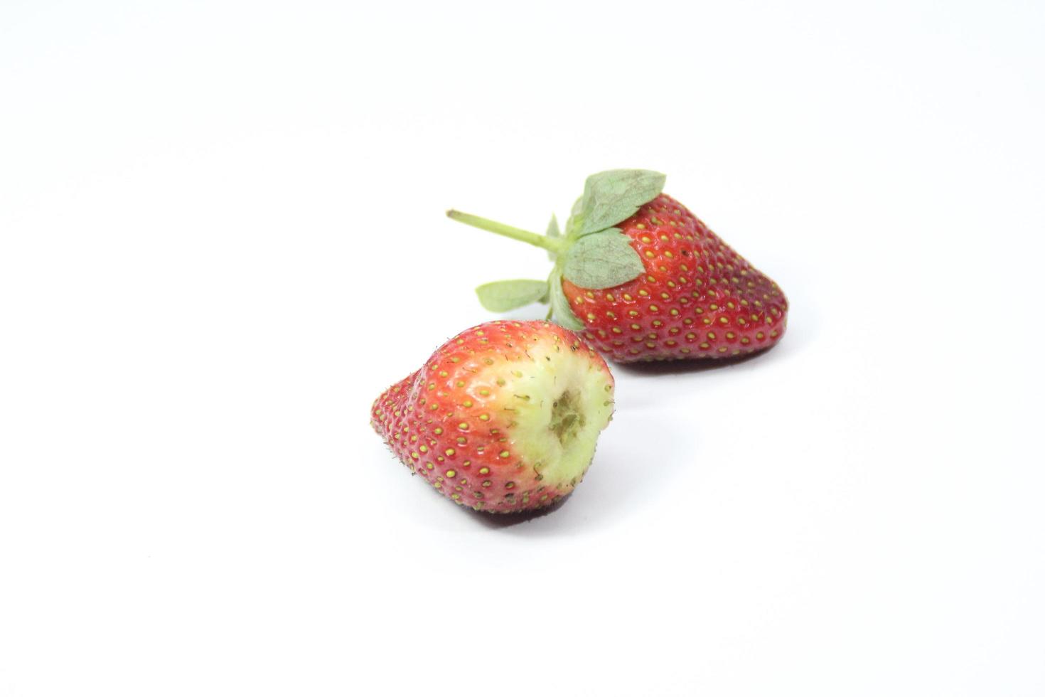 Two strawberries on a white background photo