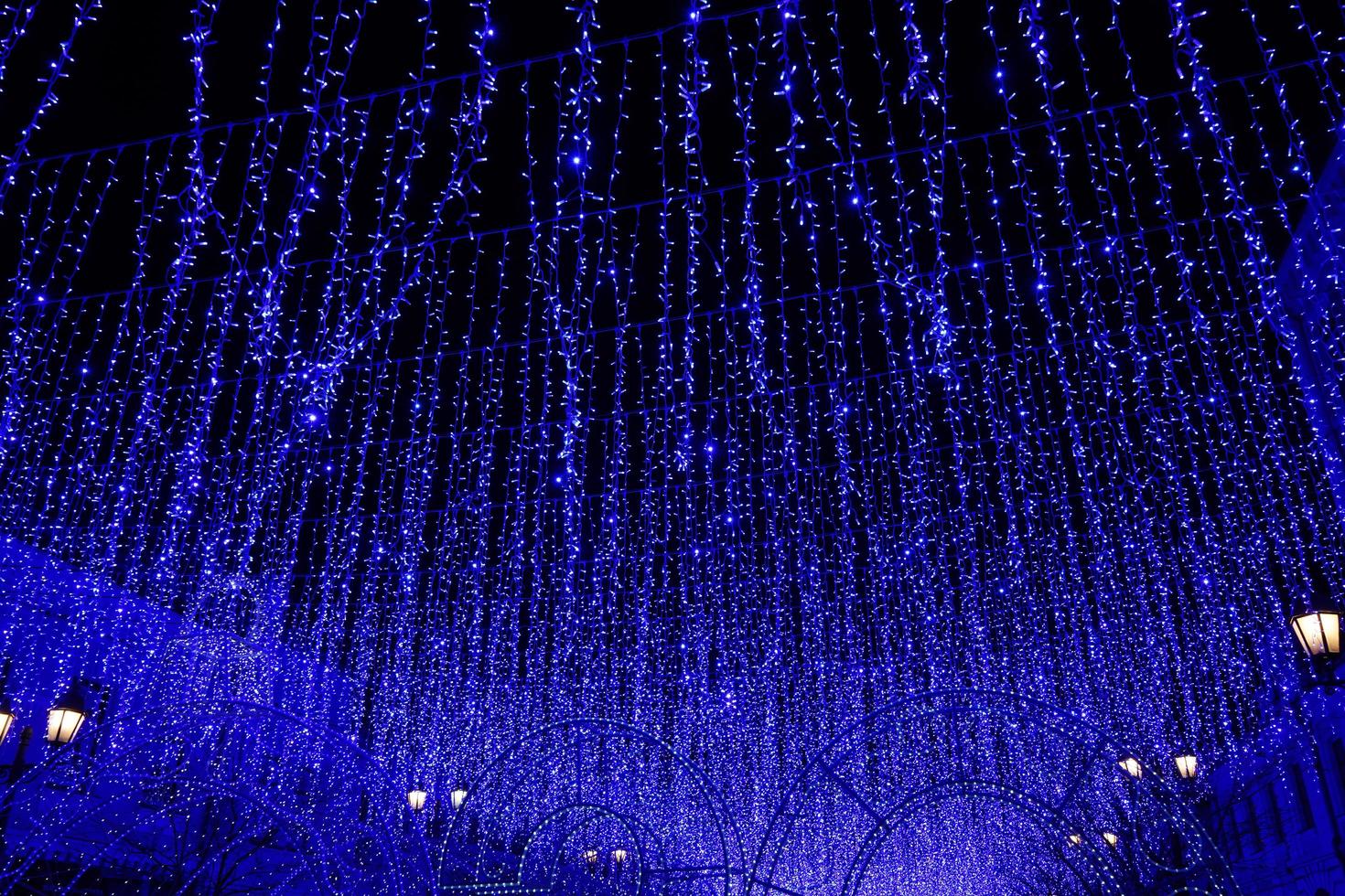 Night city landscape with blue string lights in Vladivostok, Russia photo