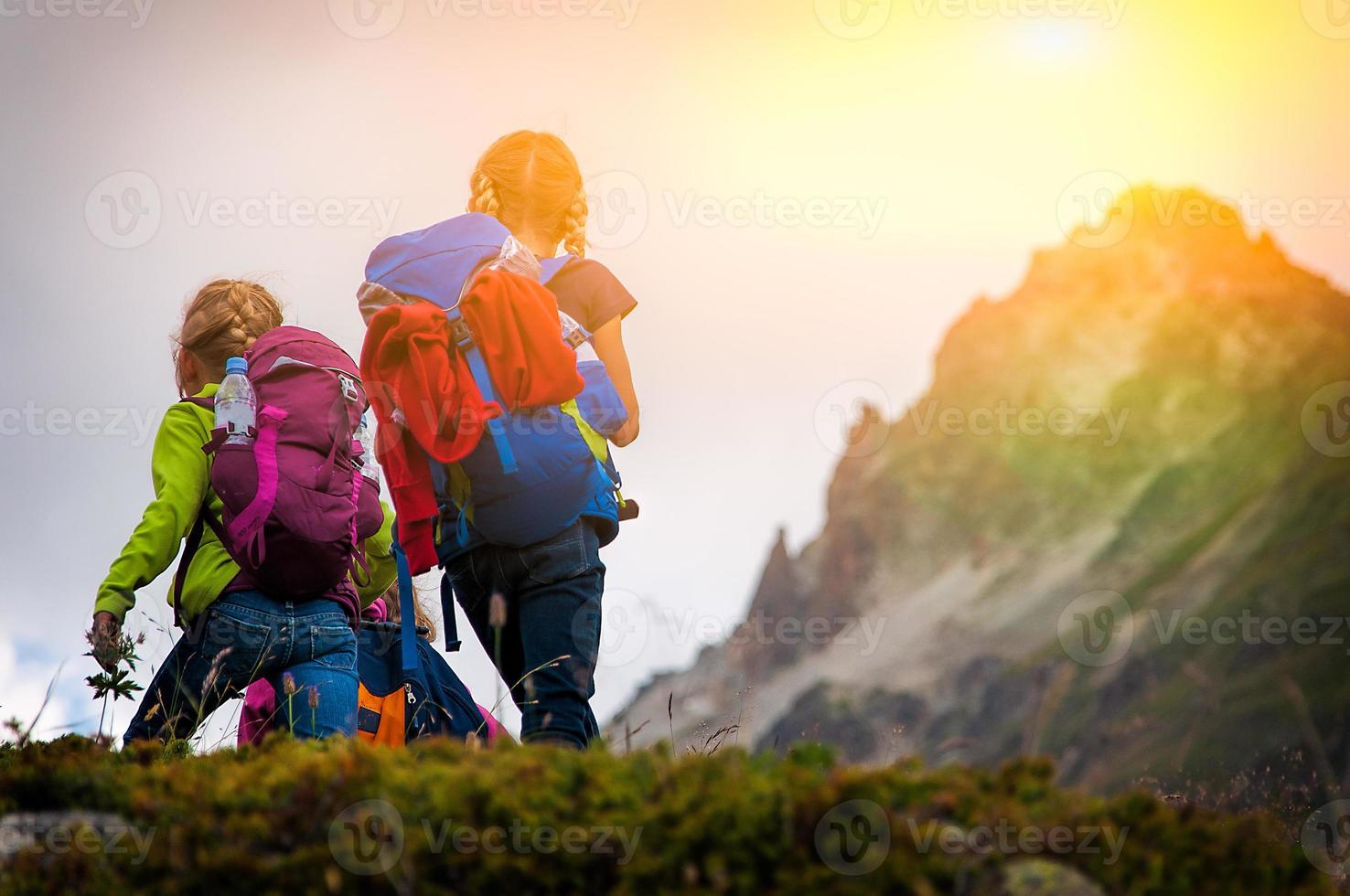 Little girls trek in the mountains photo