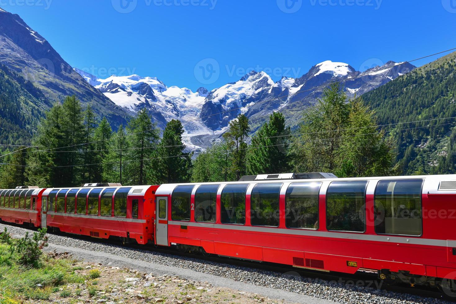 Swiss mountain train crosses the Alps photo