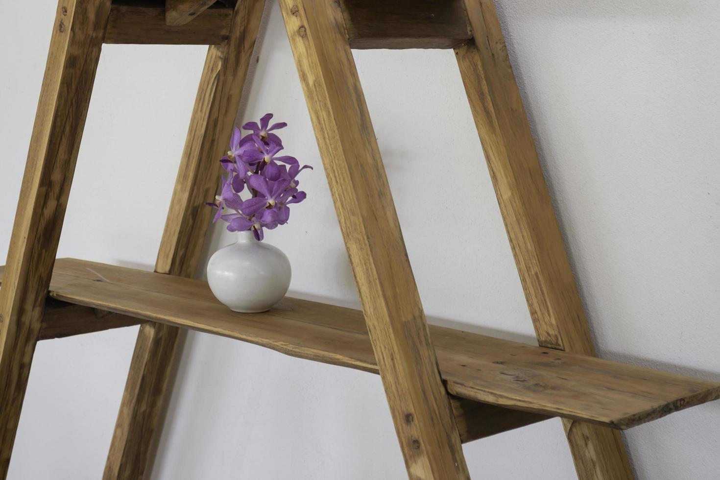Ladder shelf with a purple plant photo