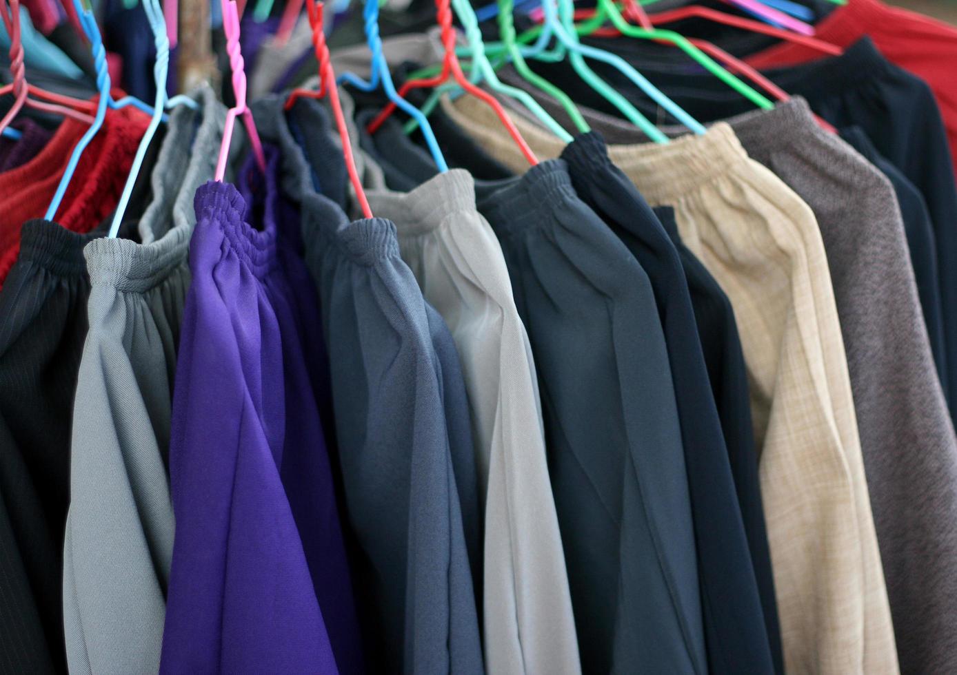 Pants hanging on a rack photo