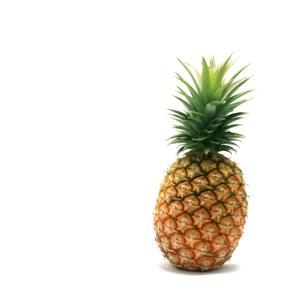 Ripe pineapple isolated on a white background photo