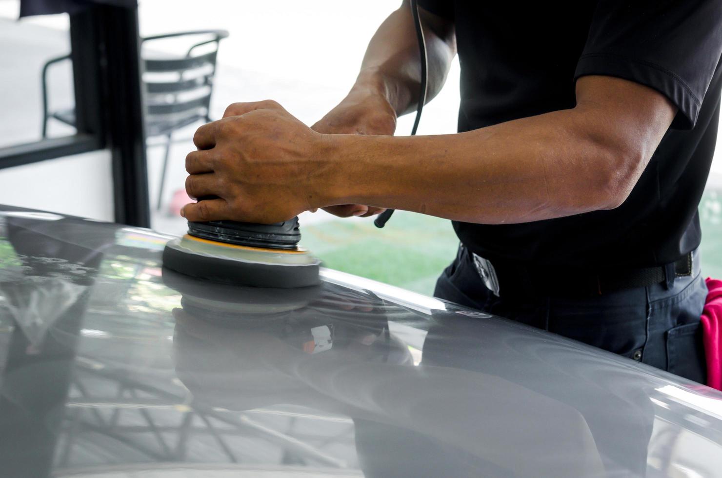 Man buffing car wax photo