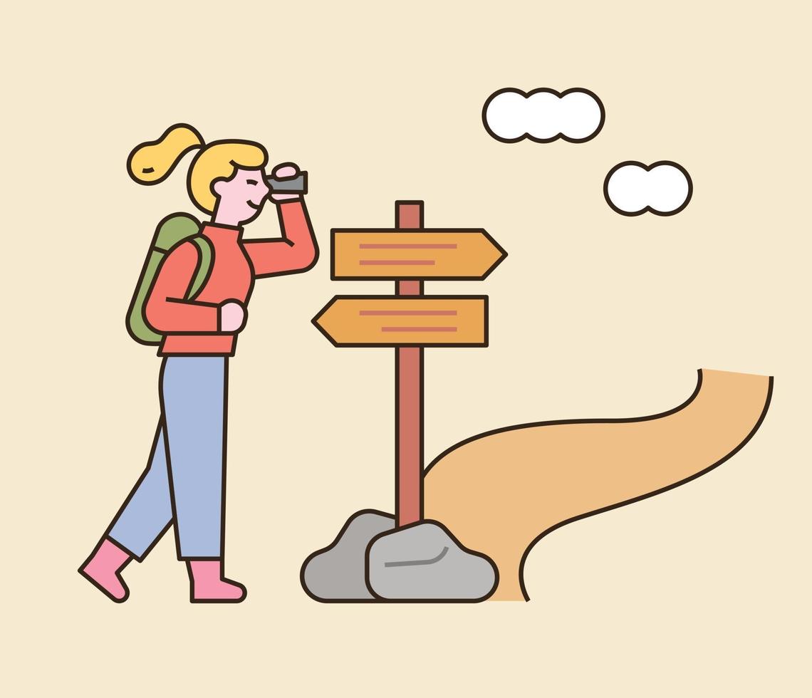 A woman is backpacking. She is looking for her way in front of a direction sign. flat design style minimal vector illustration.