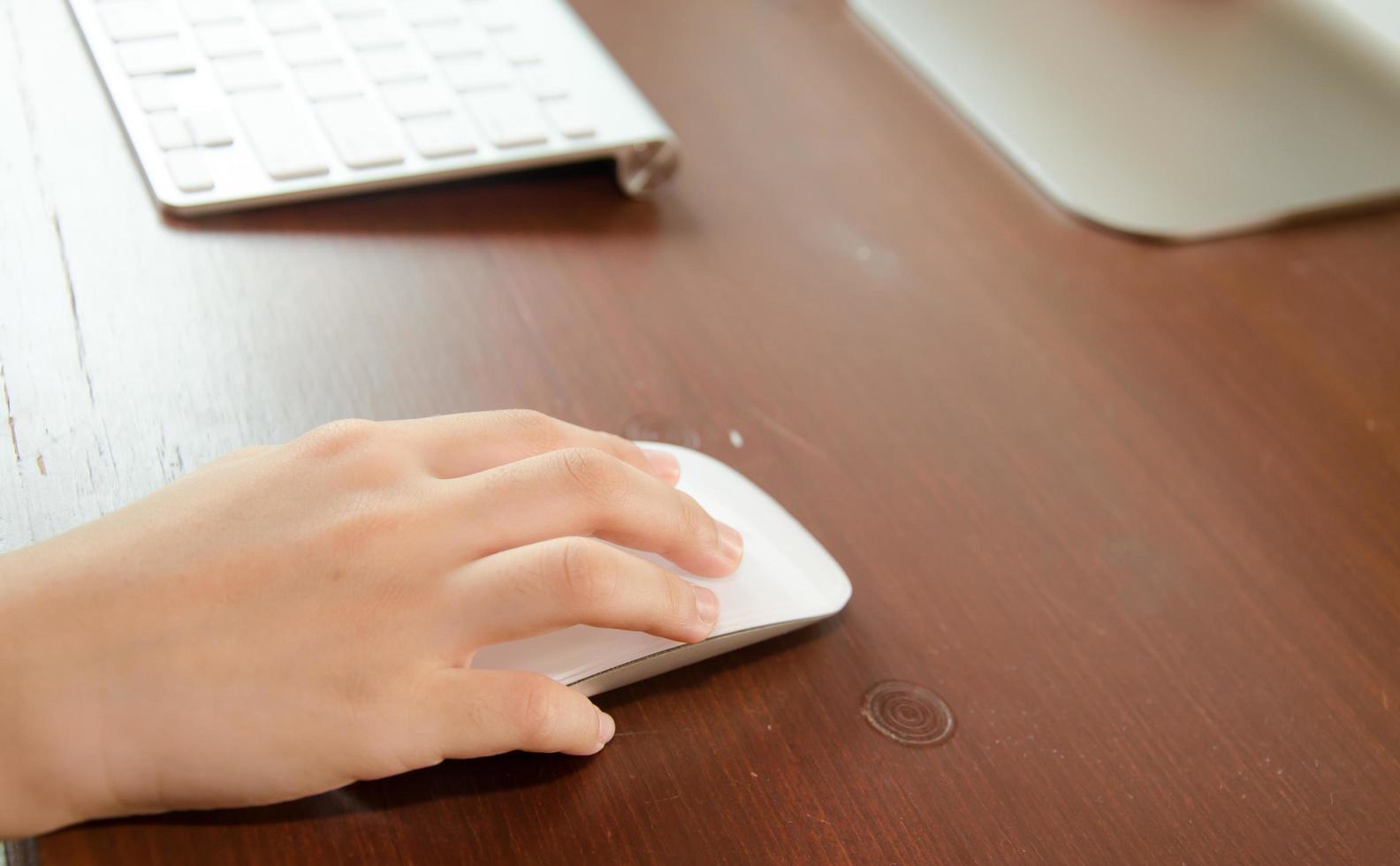 Hand on a computer mouse photo