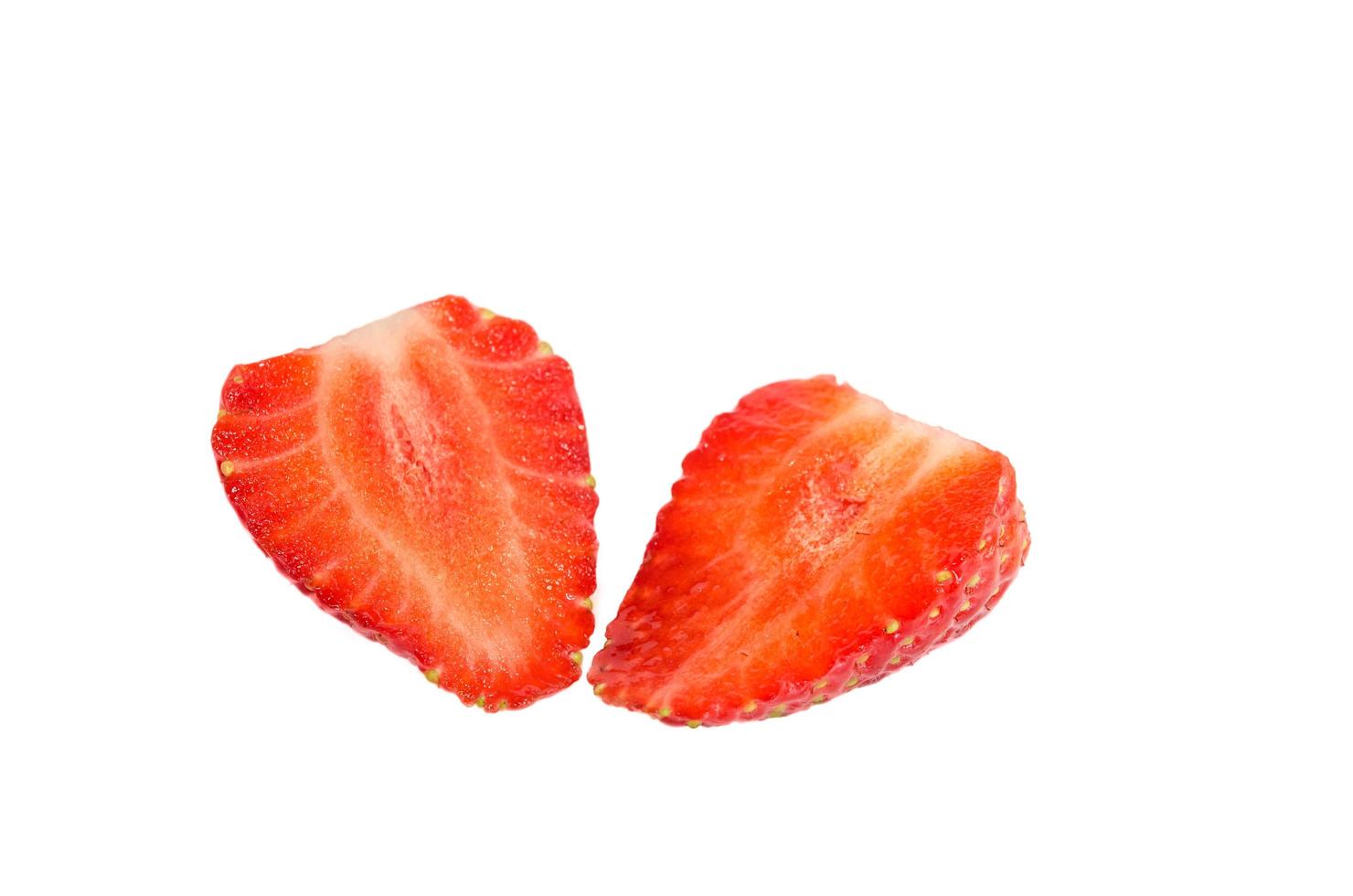 Sliced strawberry on white photo