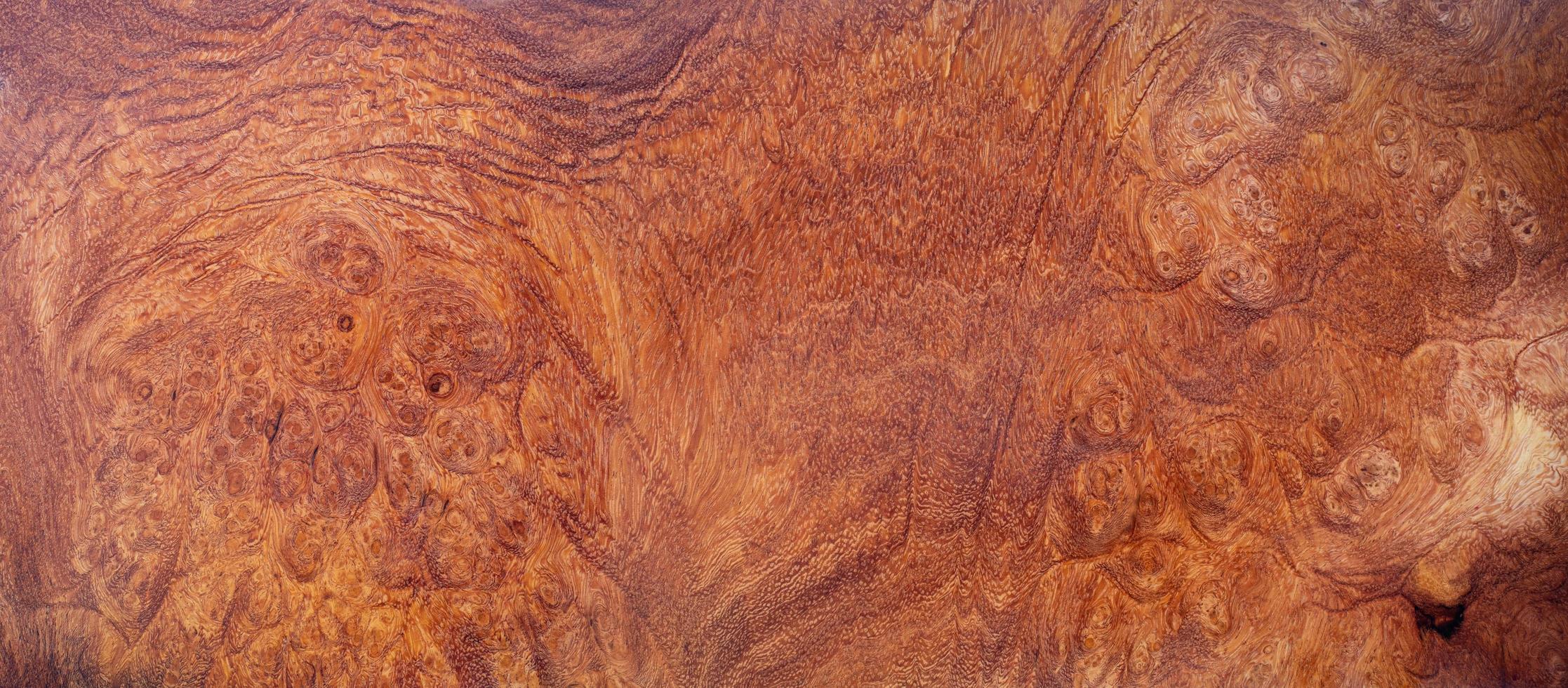 Fondo de textura de patrón de madera de burl de afzelia natural foto