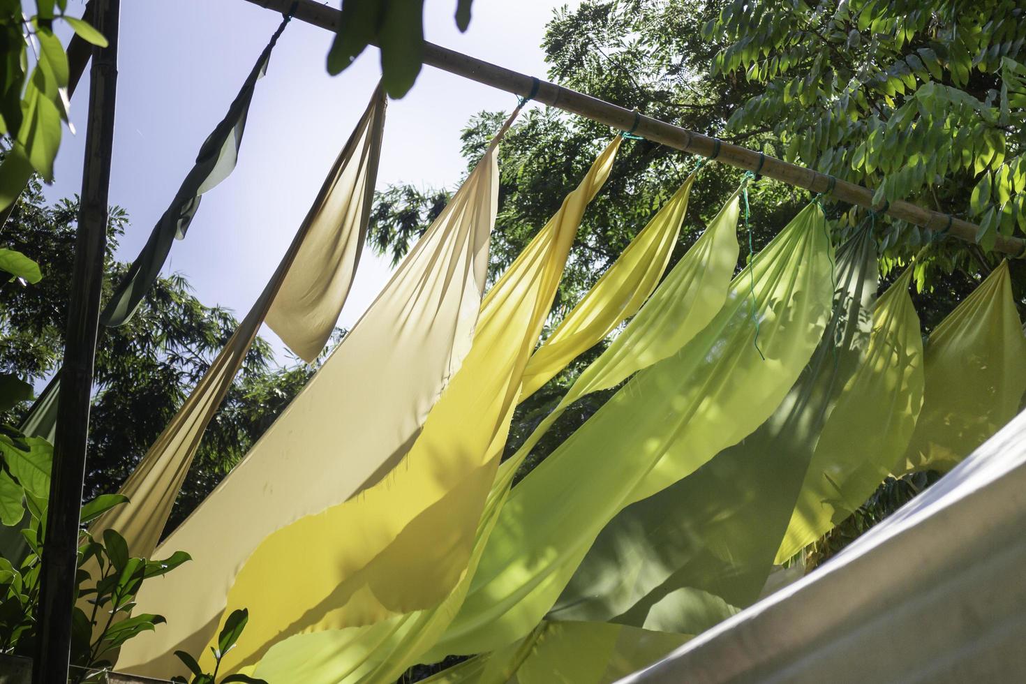 Hanging colorful fabric in the garden photo
