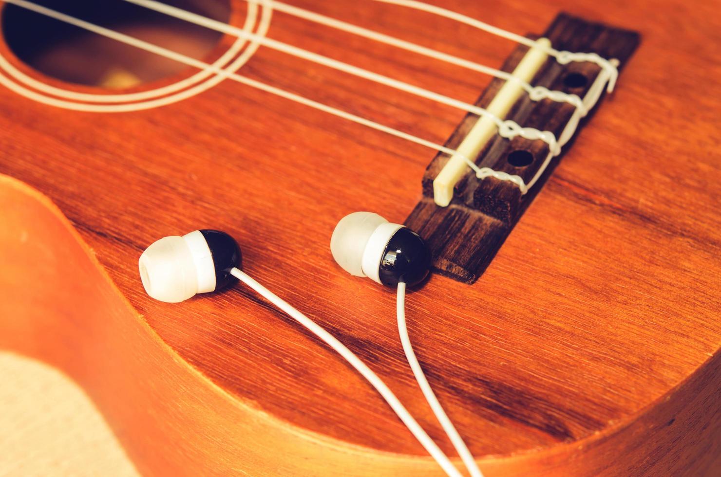 Earpods on a ukulele photo