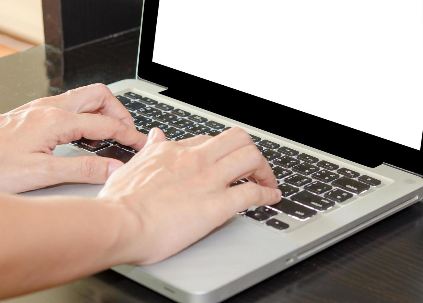 Person typing on a laptop mock-up photo