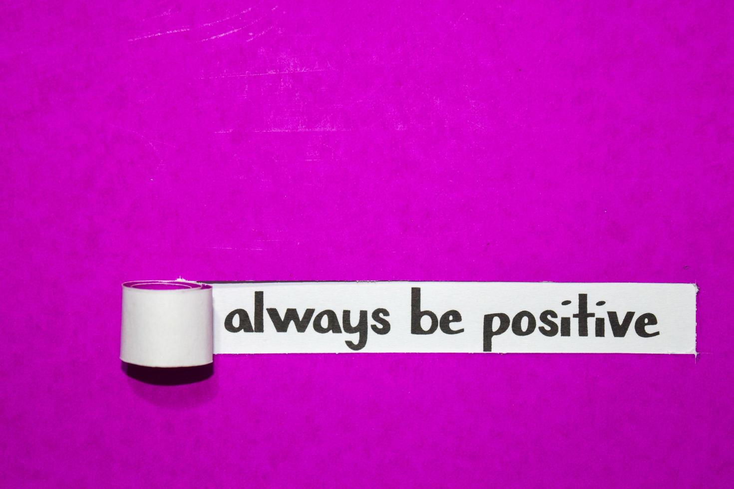 Always be positive text, Inspiration, Motivation and business concept on purple torn paper photo