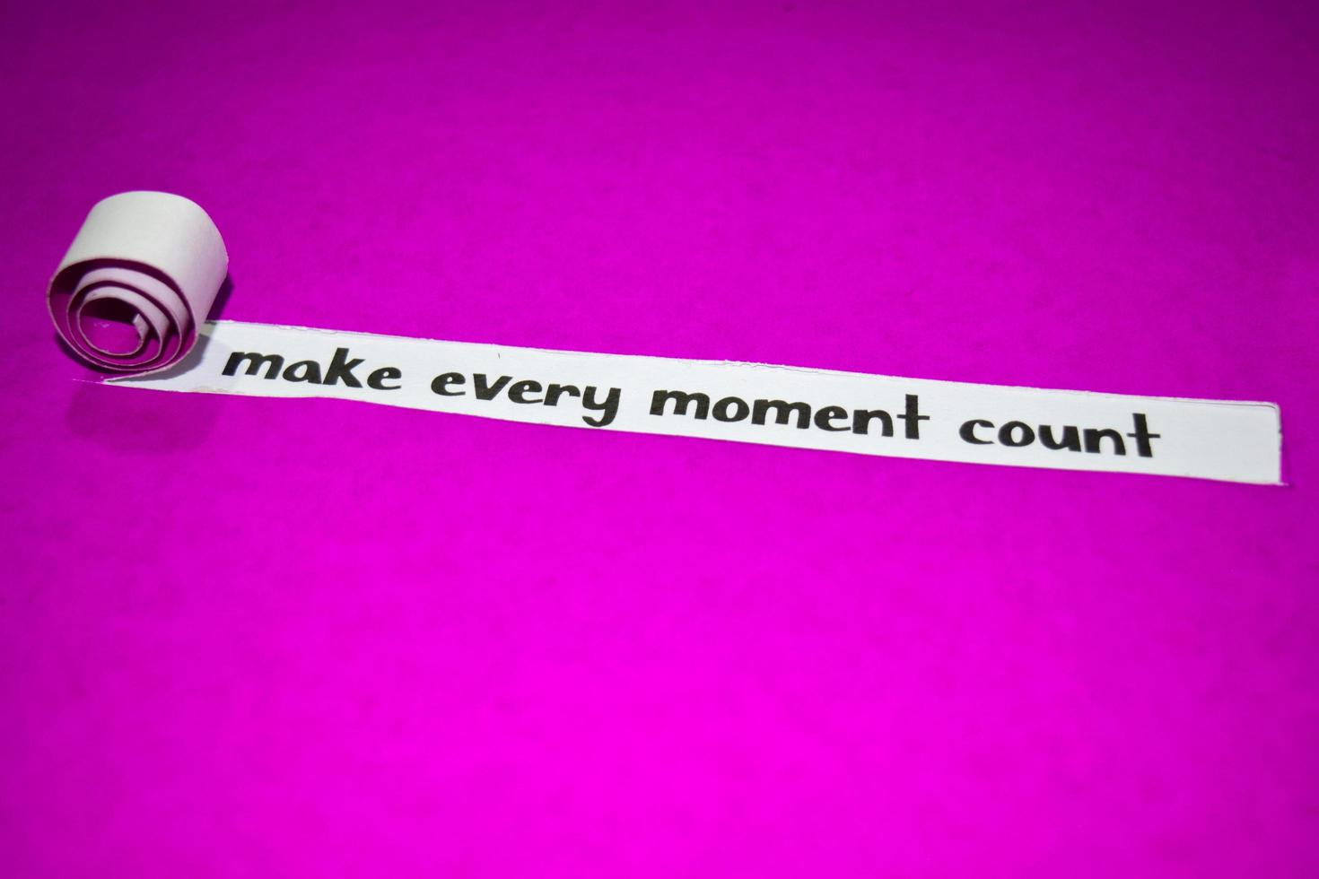 Make every moment count text, Inspiration, Motivation and business concept on purple torn paper photo