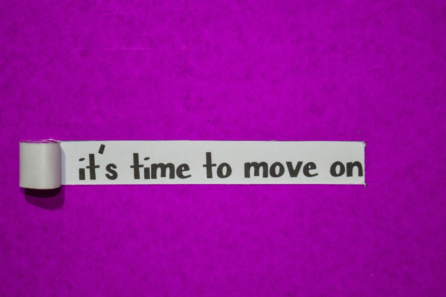 It's time to move on text, Inspiration, Motivation and business concept on purple torn paper photo