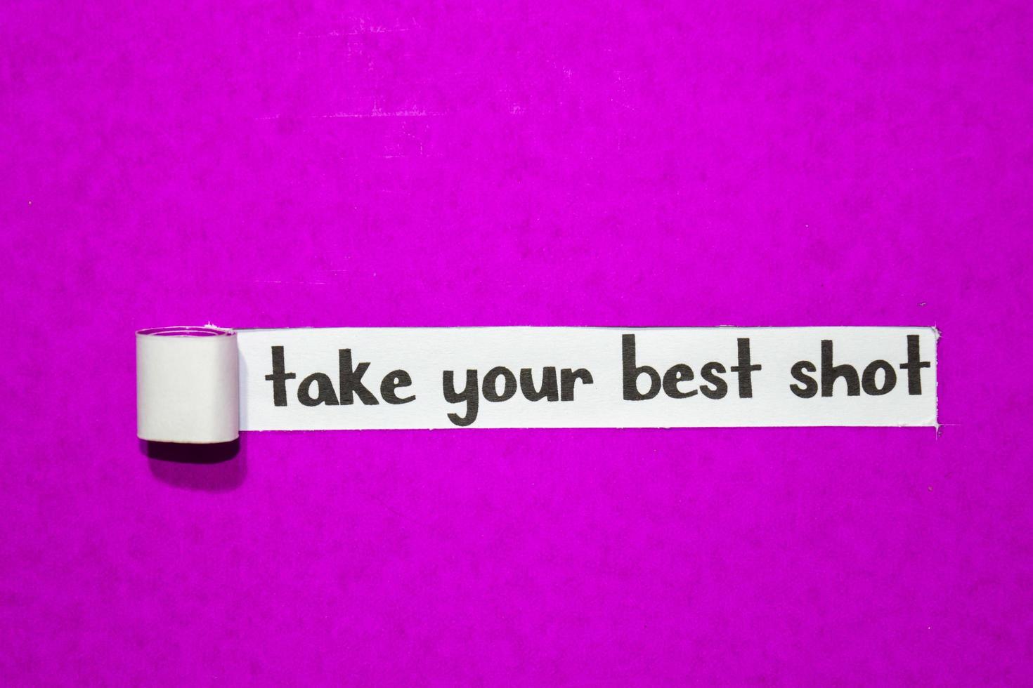 Take your best shot text, Inspiration, Motivation and business concept on purple torn paper photo