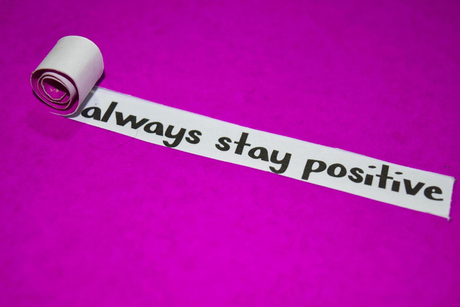 Always stay positive text, Inspiration, Motivation and business concept on purple torn paper photo