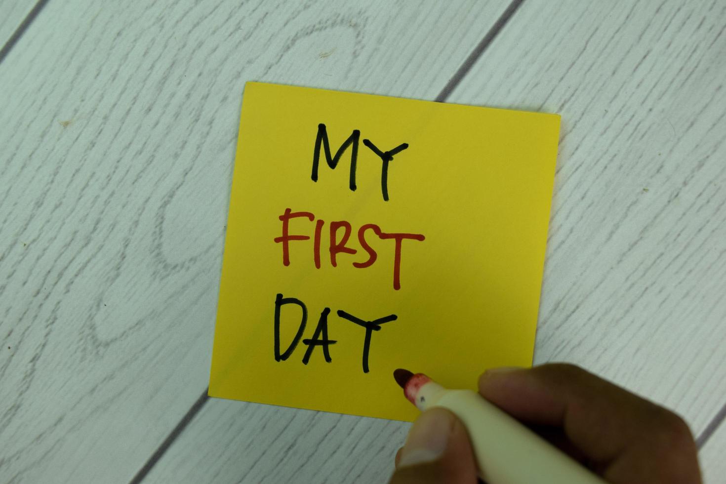 My First Day written on sticky note isolated on wooden table photo