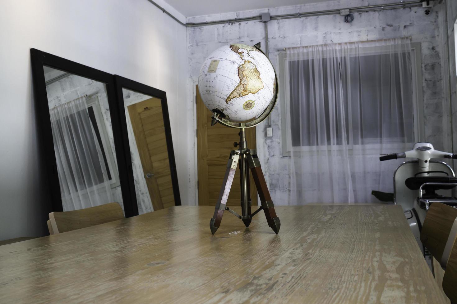 Vintage globe on top of the table photo