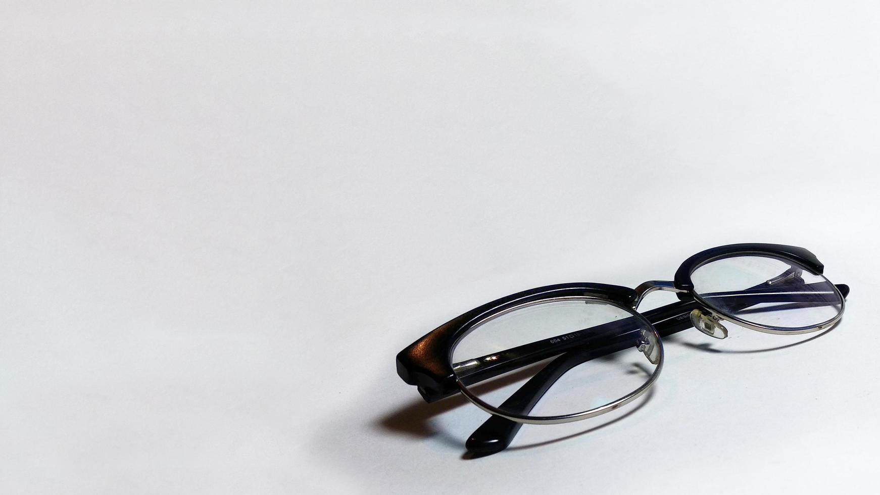 Eyeglass specs in perspective on clean and isolated background photo