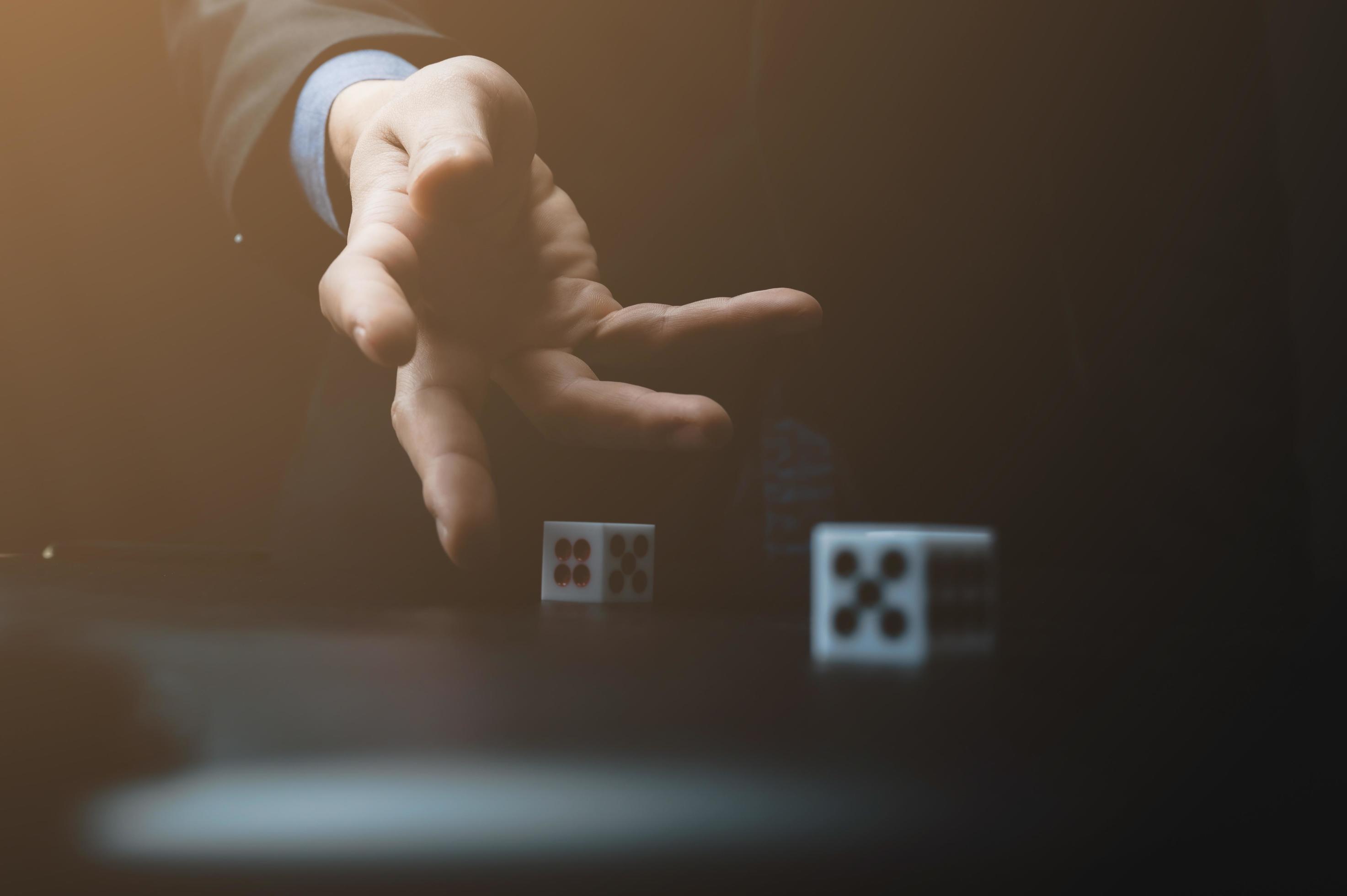 Hand throwing dice 2131277 Stock Photo at Vecteezy