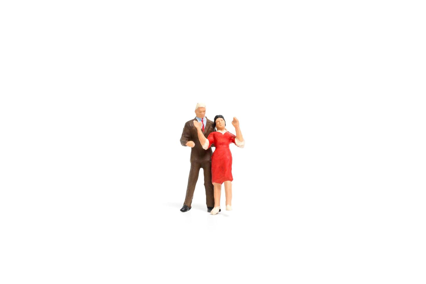 Miniature couple romantic dancing on a white background, Valentine's Day concept photo