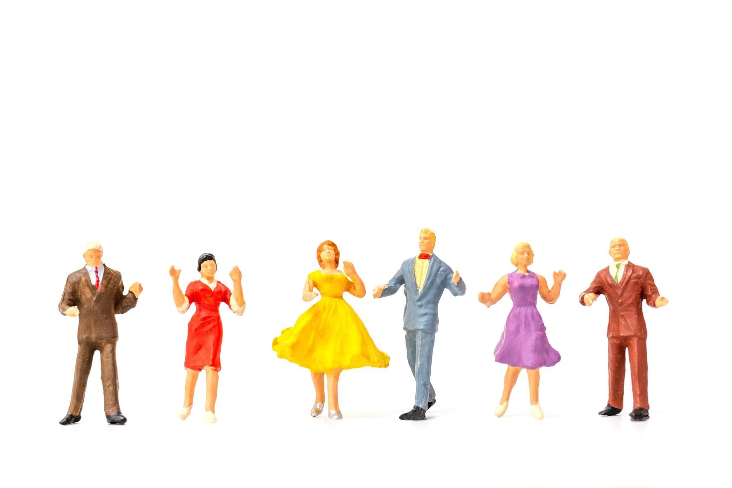 Miniature people dancing on s white background, Valentine's Day concept photo