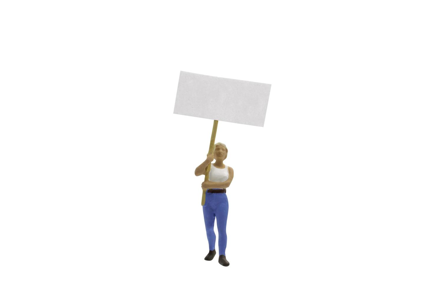 Miniature protester isolated on a white background photo