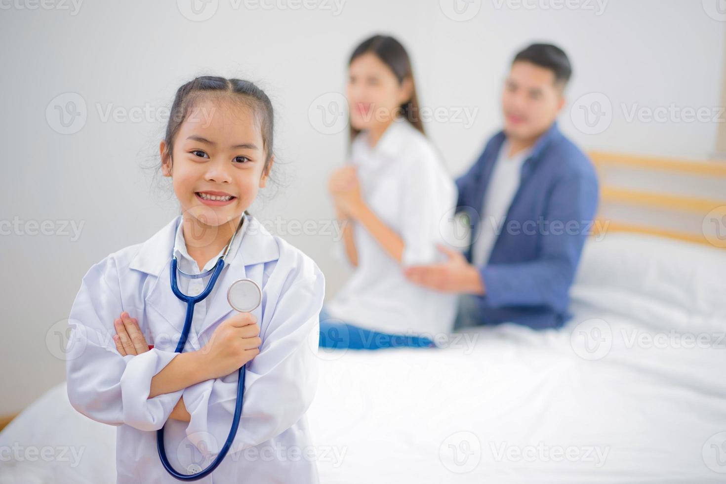 Girl dressed like a doctor at home photo