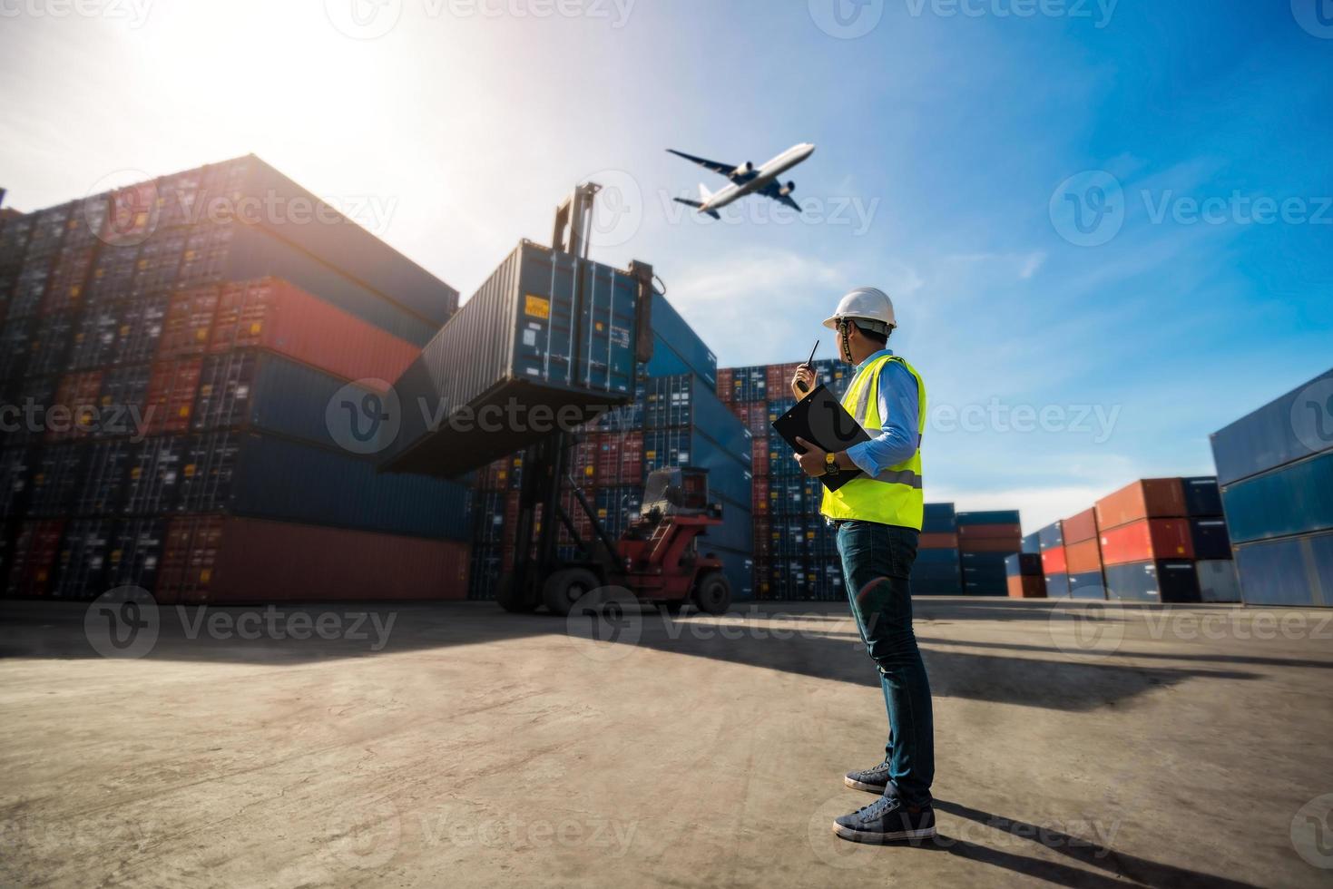 Foreman controller coordinating cargo export photo