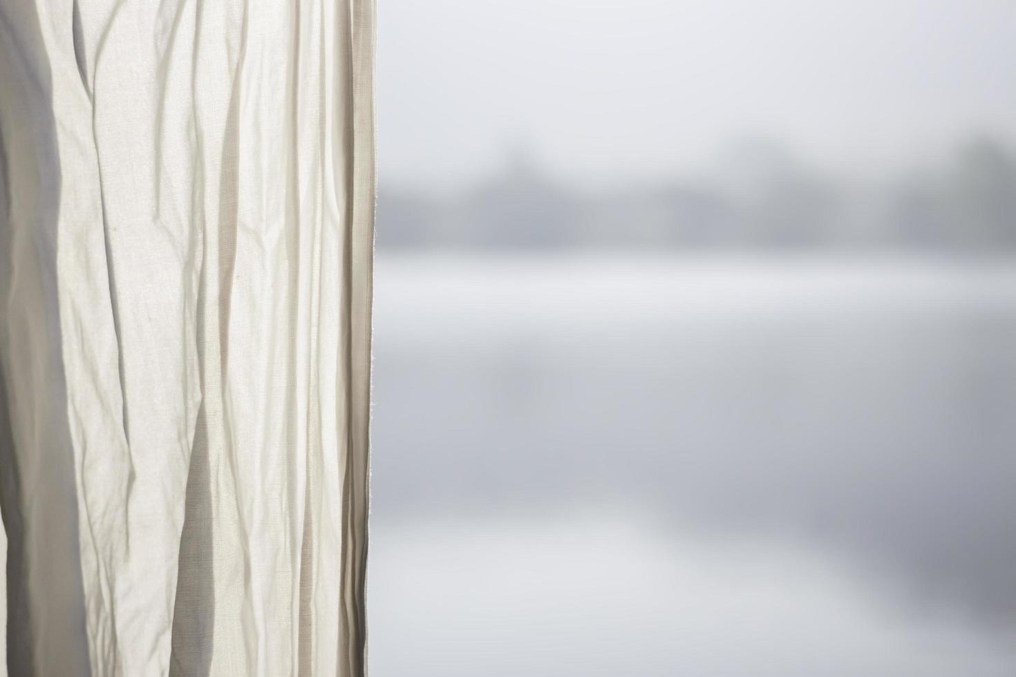 Curtain with a lake in the background photo