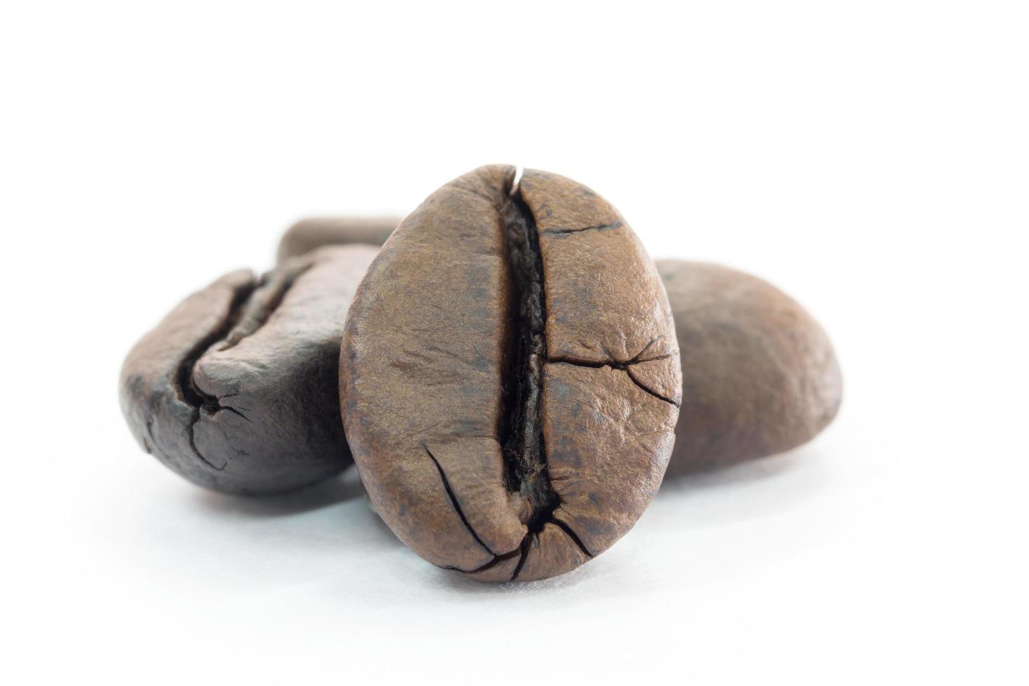 Roasted coffee beans on a white background photo