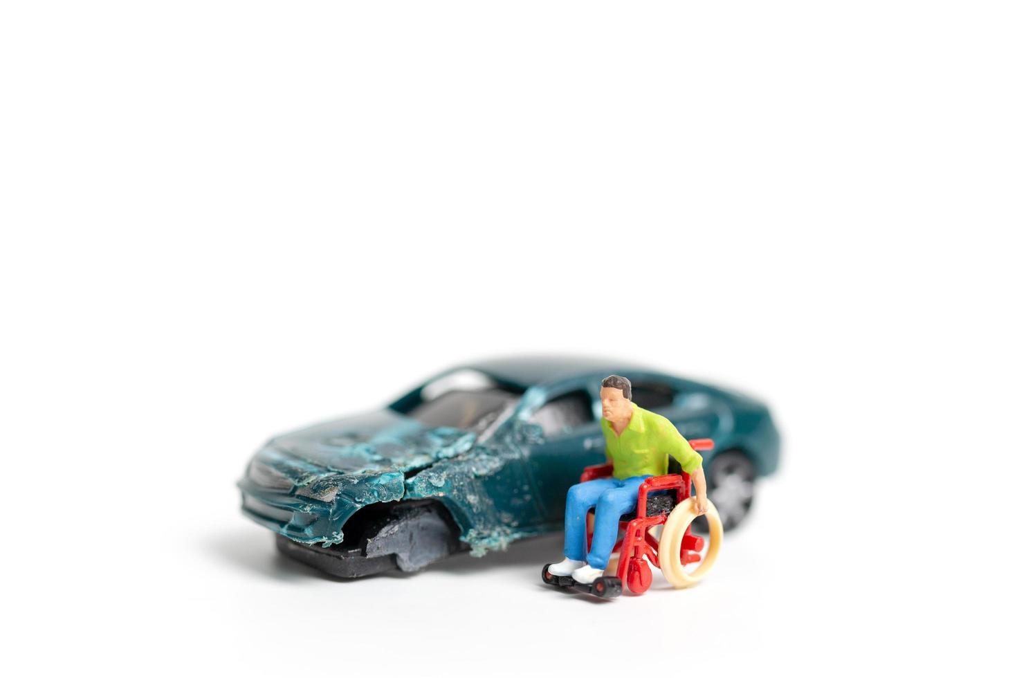 Miniature person at the scene of a car accident, car crash on a white background, drive safely concept photo