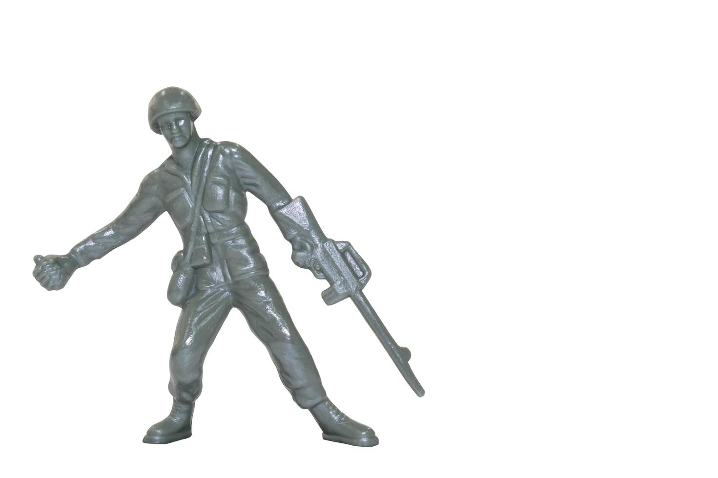 Miniature toy soldier on a white background photo